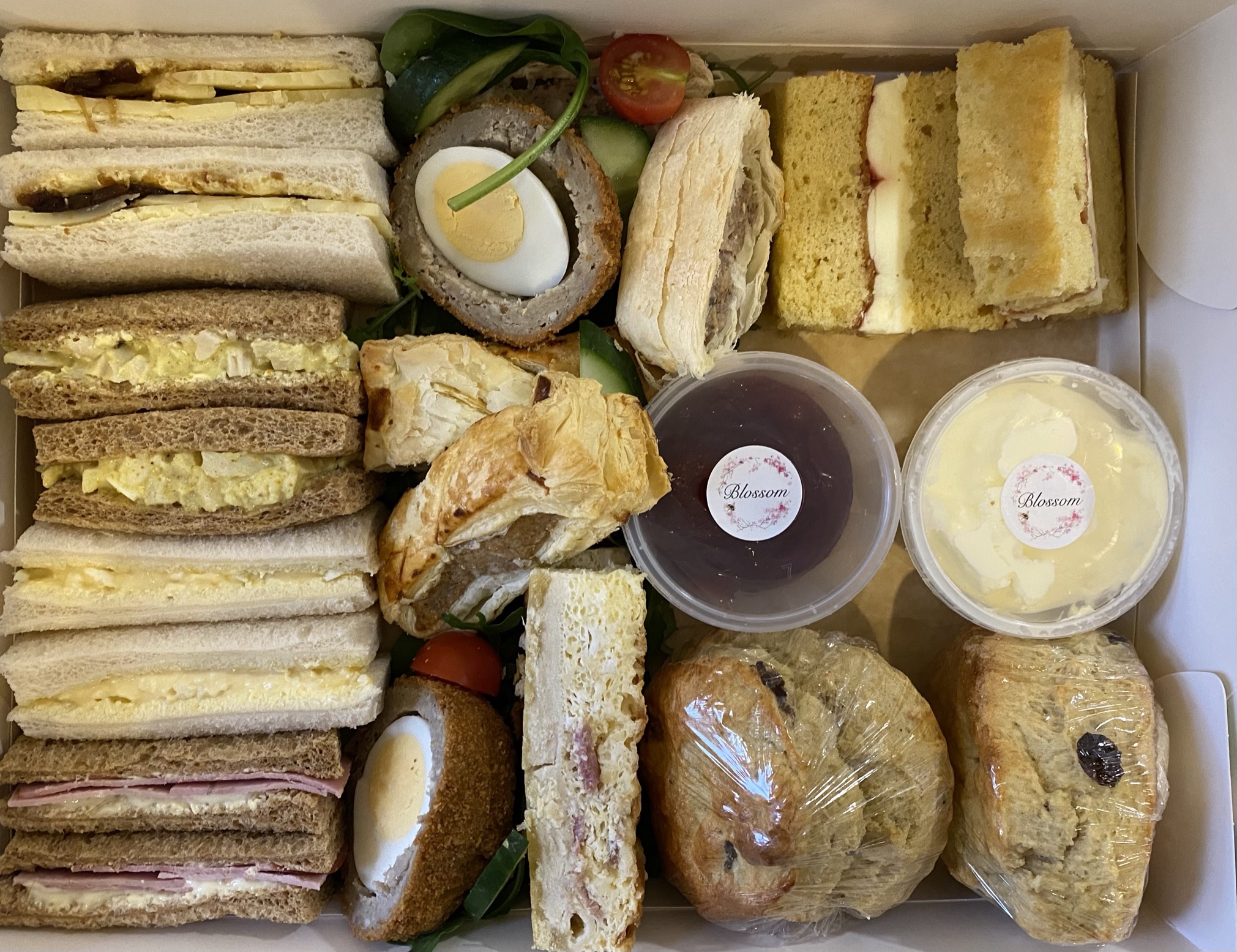 Savoury afternoon tea with quiche and scotch eggs